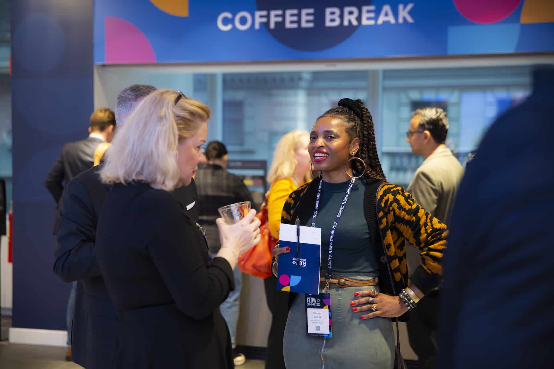 Signifyd FLOW Summit 2022attendees network during a break in the programming