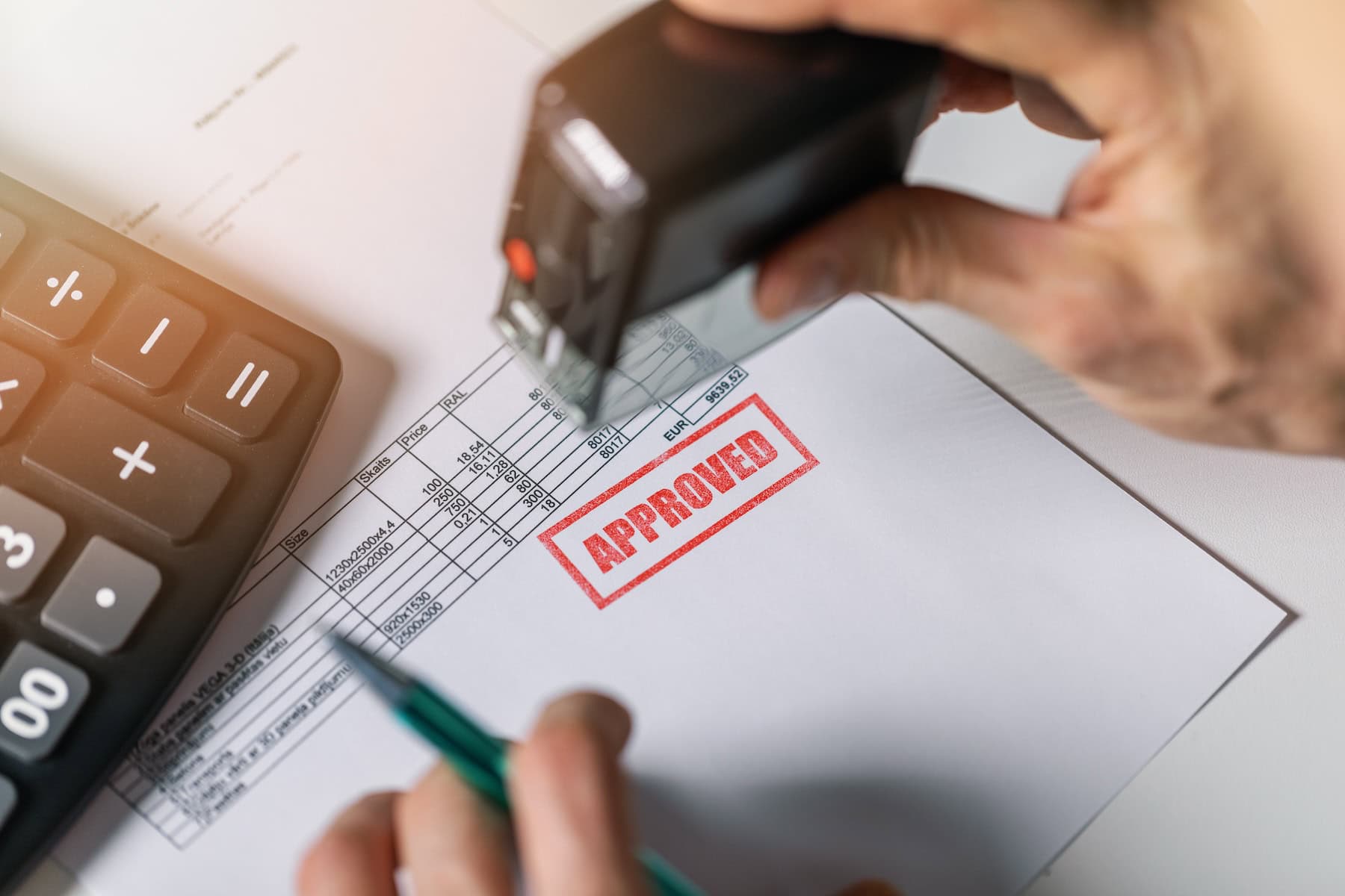 Legal looking document on a desk with a big, red stamp 