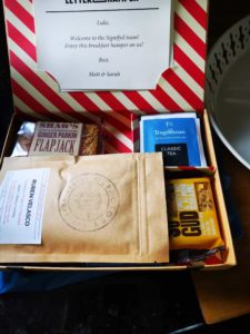 Gift box of coffee cake, tea and snacks for Signifyd new hires in Belfast