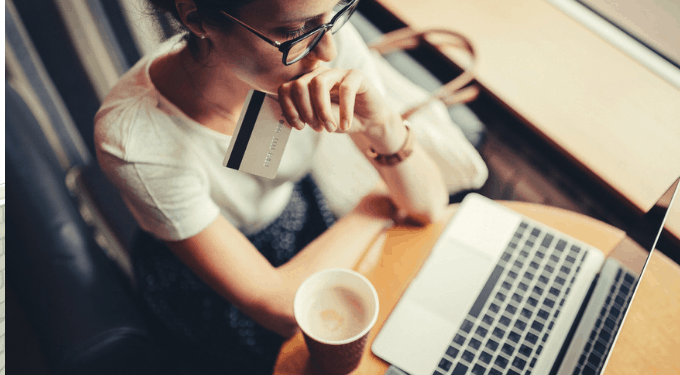 Consumer pondering an online order delay at laptop